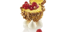 GRANOLA MYSTERY FILLED WITH MANGO SORBET, RED FRUITS HEART, RASPBERRY COULIS AND MERINGUE DROPS