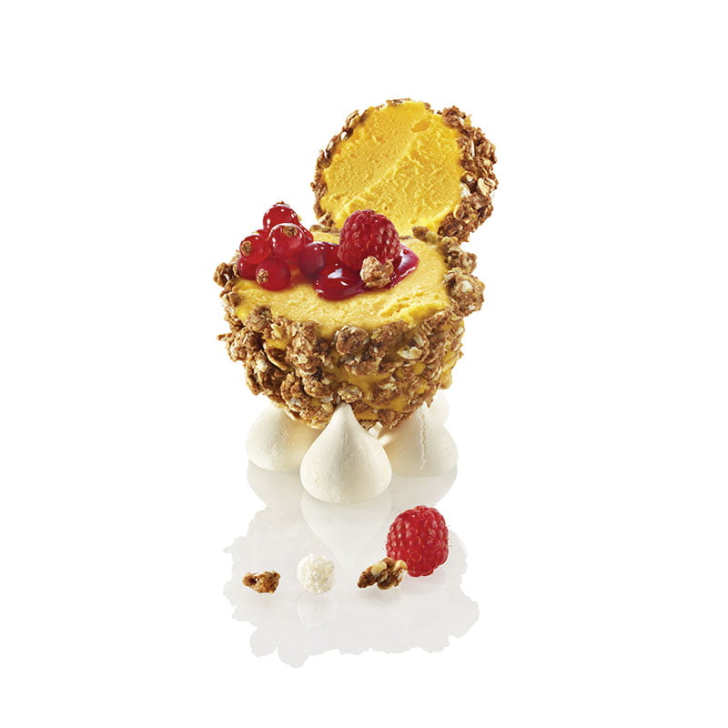 GRANOLA MYSTERY FILLED WITH MANGO SORBET, RED FRUITS HEART, RASPBERRY COULIS AND MERINGUE DROPS
